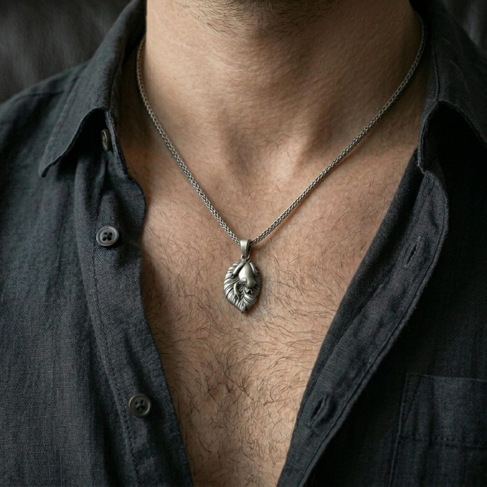 Oxidized frog pendant with leaf motif design worn on the neck in a lifestyle jewelry shot, styled against the chest for a playful and nature-inspired statement look