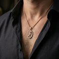 Load image into Gallery viewer, A rose gold plated oval cat pendant worn on the neck, sleek everyday necklace with a subtle familiar-inspired charm.
