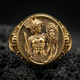 Load image into Gallery viewer, A gold plated Perseus and Medusa signet ring on black volcanic stone, Greek key background and hero motif in sharp relief.
