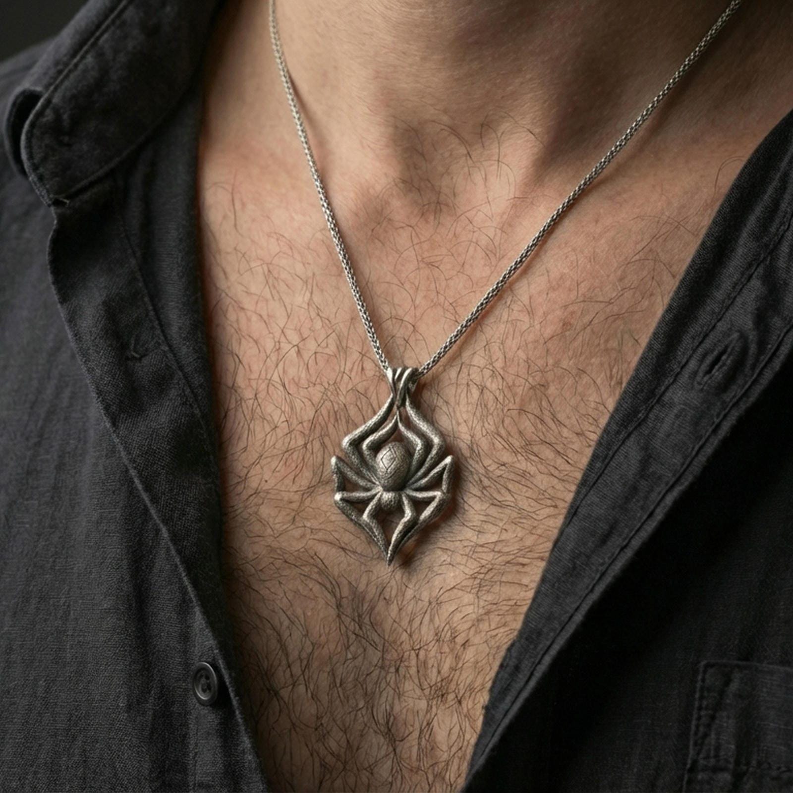 Oxidized spider pendant with sculpted arachnid form worn on the neck in a lifestyle jewelry shot, styled against the chest for a bold and gothic statement look