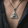 Load image into Gallery viewer, Polished silver all-seeing eye pendant necklace worn on the neck, shown against the chest in a clean and elegant everyday wear composition.
