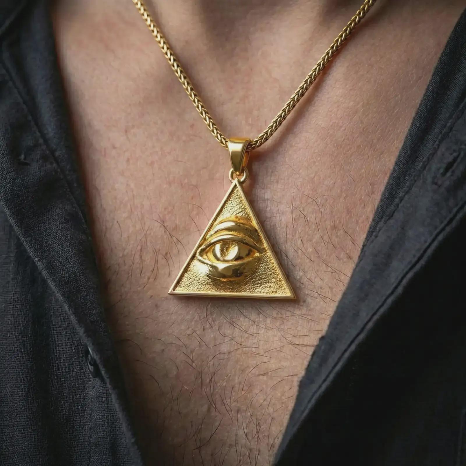 Gold plated all-seeing eye pendant necklace worn on the neck, captured on a human model in a premium dark-toned lifestyle frame.