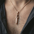 Load image into Gallery viewer, Rose gold plated King Tut pendant necklace worn on the neck, presented in a close-up lifestyle shot with a refined masculine aesthetic.
