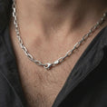 Load image into Gallery viewer, Polished silver cable link chain necklace worn on the neck, shown against the chest in a clean and elegant everyday wear composition.
