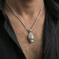 Load image into Gallery viewer, Polished silver gorilla head pendant necklace worn on the neck, shown against the chest in a clean and elegant everyday wear composition.
