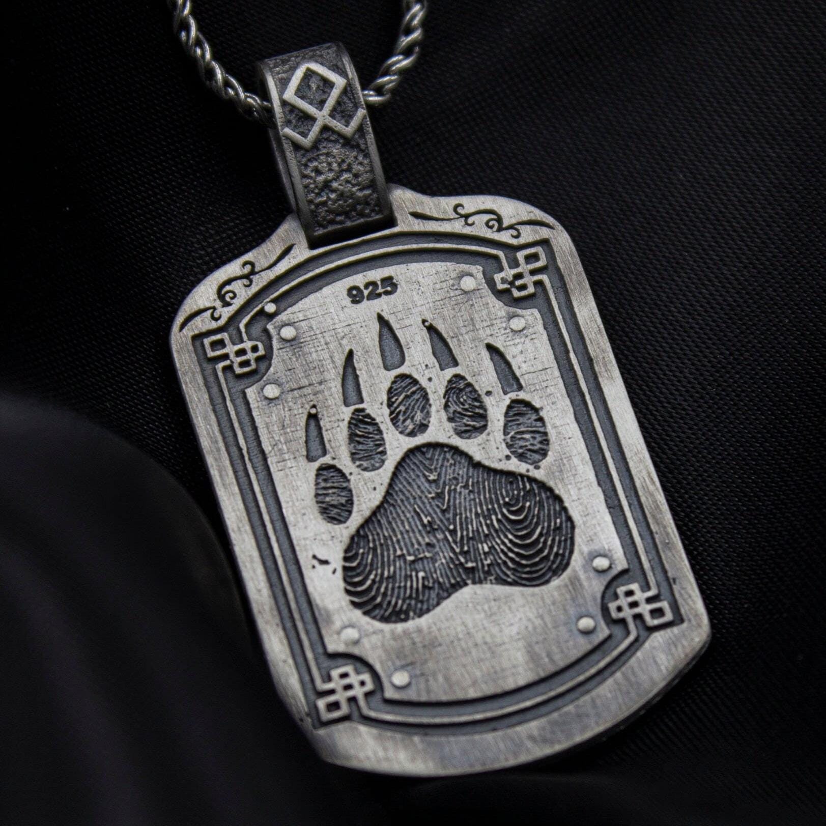 Bear paw pendant in oxidized finish over sterling silver