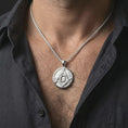 Load image into Gallery viewer, Polished silver Masonic emblem pendant necklace worn on the neck, shown against the chest in a clean and elegant everyday wear composition.
