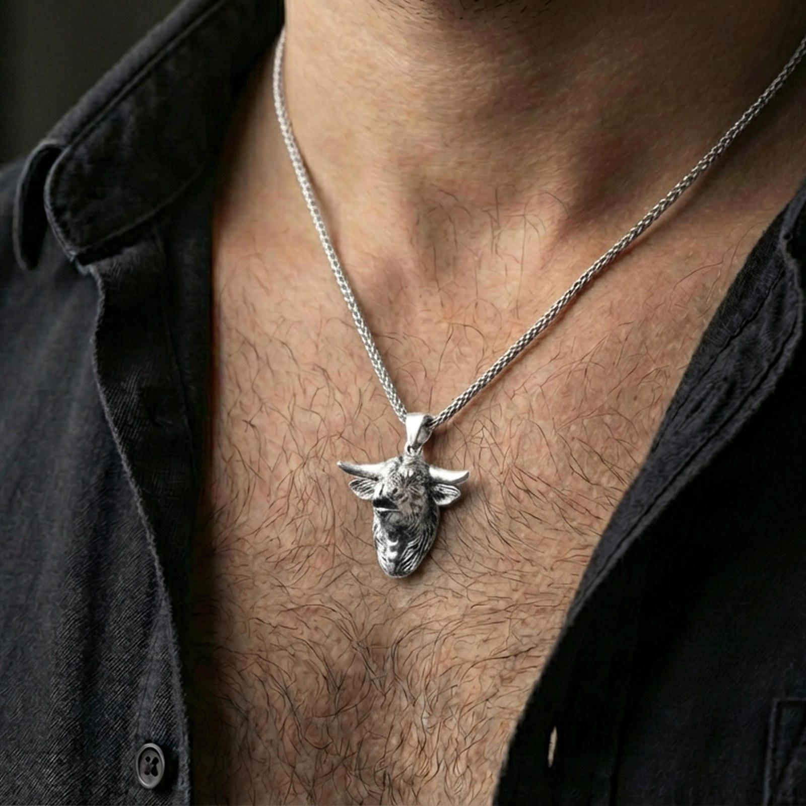 Polished silver buffalo head pendant necklace worn on the neck, shown against the chest in a clean and elegant everyday wear composition.