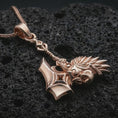 Load image into Gallery viewer, Rose gold plated paladin hammer pendant necklace on dark volcanic rock, photographed in a detailed premium studio macro view.
