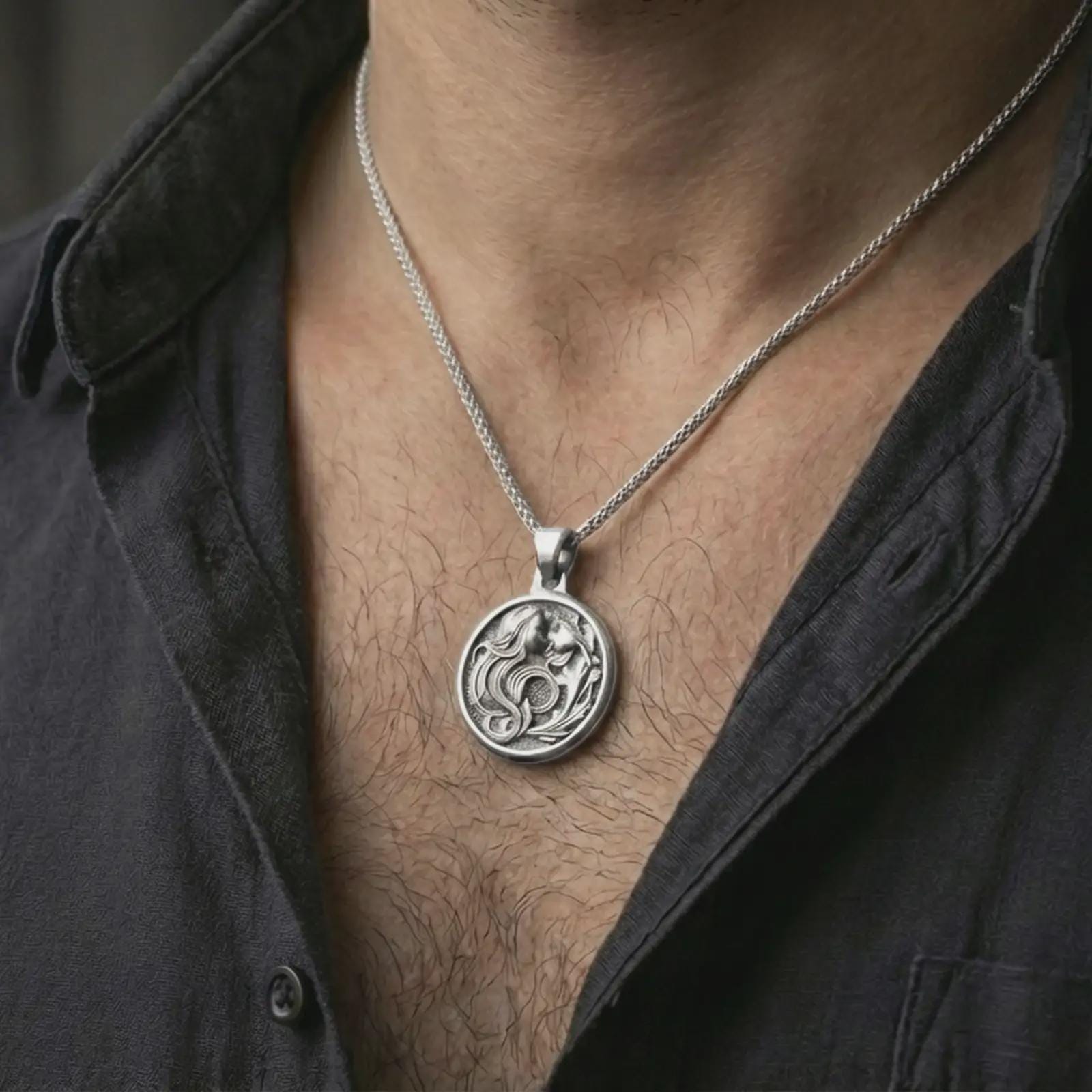 Polished silver Art Nouveau woman pendant necklace worn on the neck, shown against the chest in a clean and graceful everyday wear composition.