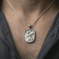 Load image into Gallery viewer, Polished silver Roman soldier pendant necklace worn on the neck, shown against the chest in a clean and elegant everyday wear composition.
