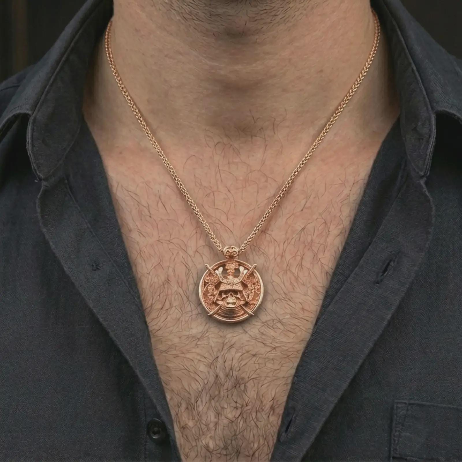 Rose gold plated samurai skull pendant necklace worn on the neck, presented in a close-up lifestyle shot with a refined masculine aesthetic.