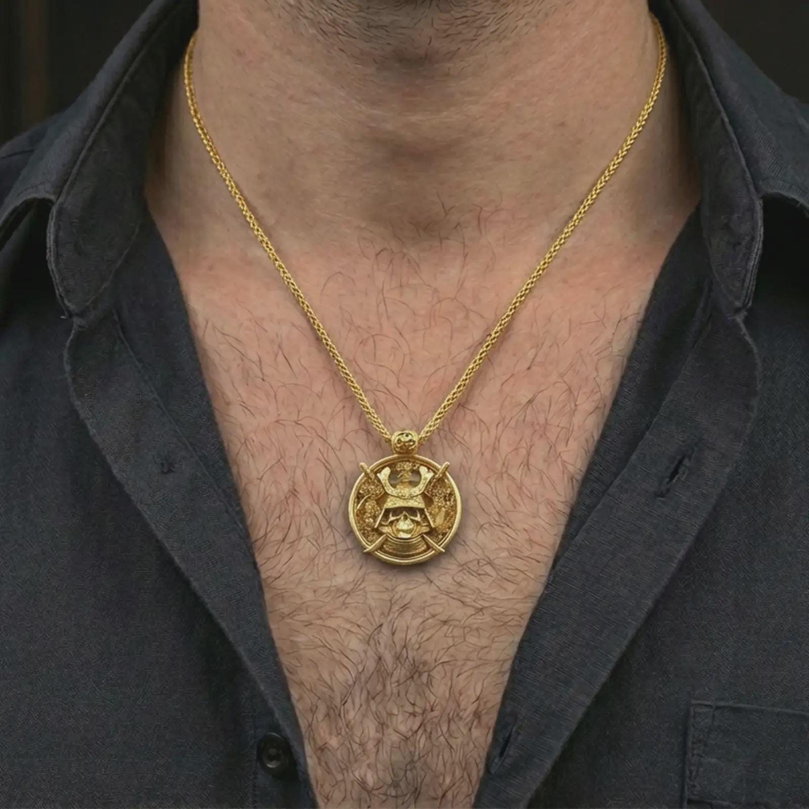 Gold plated samurai skull pendant necklace worn on the neck, captured on a human model in a premium dark-toned lifestyle frame.