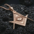 Load image into Gallery viewer, Rose gold plated Master Mason pendant necklace on dark volcanic rock, photographed in a detailed premium studio macro view.
