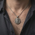 Load image into Gallery viewer, An Oni mask pendant worn on the neck in an oxidized finish, showing strong contrast and bold folklore styling.
