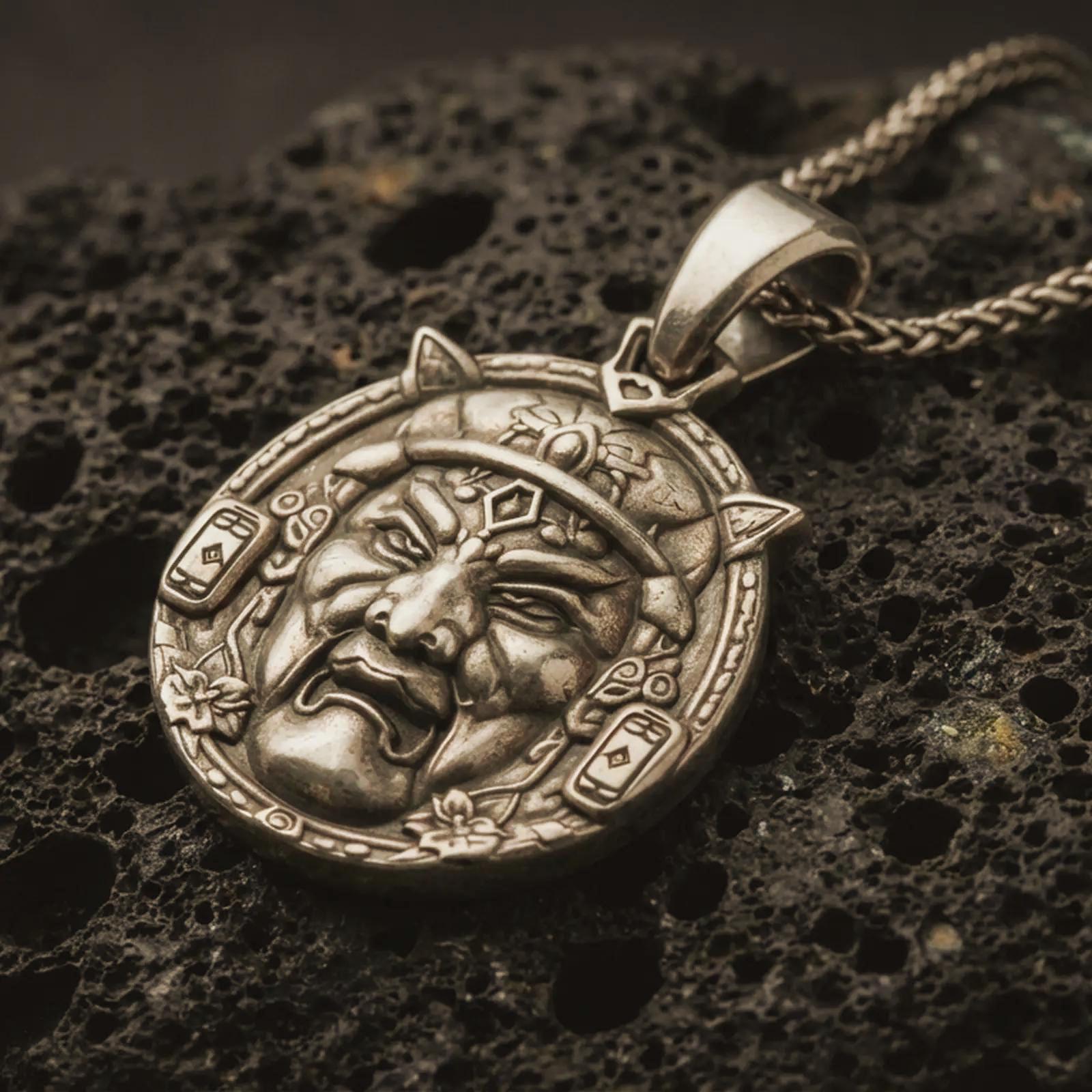 A Bronze Oni mask pendant on black volcanic stone with oxidized depth highlighting the carved face, horns, and border symbols.