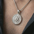 Load image into Gallery viewer, Polished silver steampunk compass pendant necklace worn on the neck, shown against the chest in a clean and elegant everyday wear composition.
