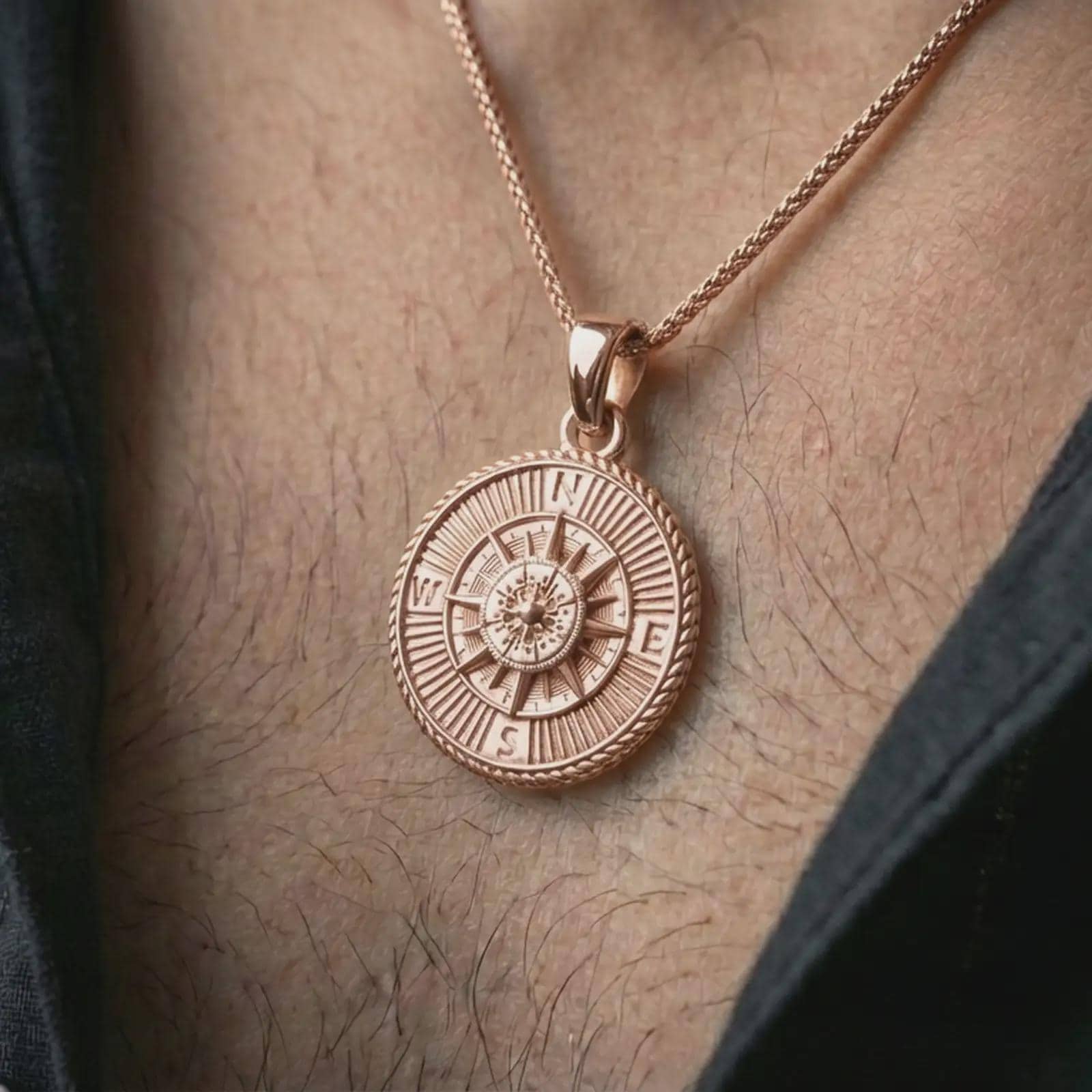 Rose gold plated steampunk compass pendant necklace worn on the neck, presented in a close-up lifestyle shot with a refined adventurous aesthetic.