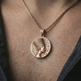 Load image into Gallery viewer, Rose gold plated Nefertiti medallion pendant necklace worn on the neck, presented in a close-up lifestyle shot with a refined regal aesthetic.
