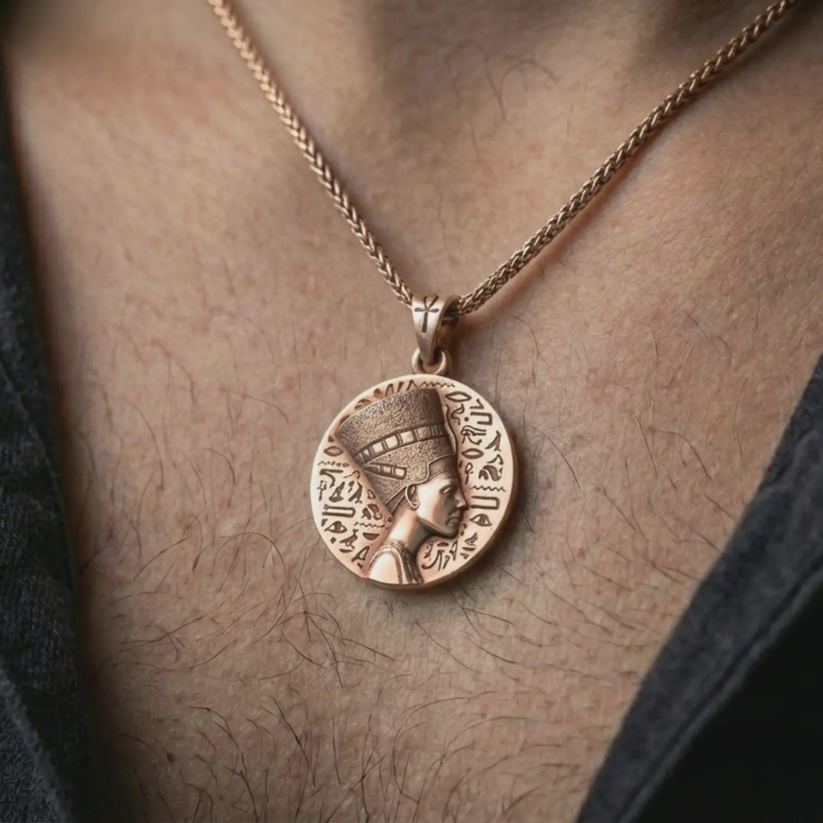 Rose gold plated Nefertiti medallion pendant necklace worn on the neck, presented in a close-up lifestyle shot with a refined regal aesthetic.