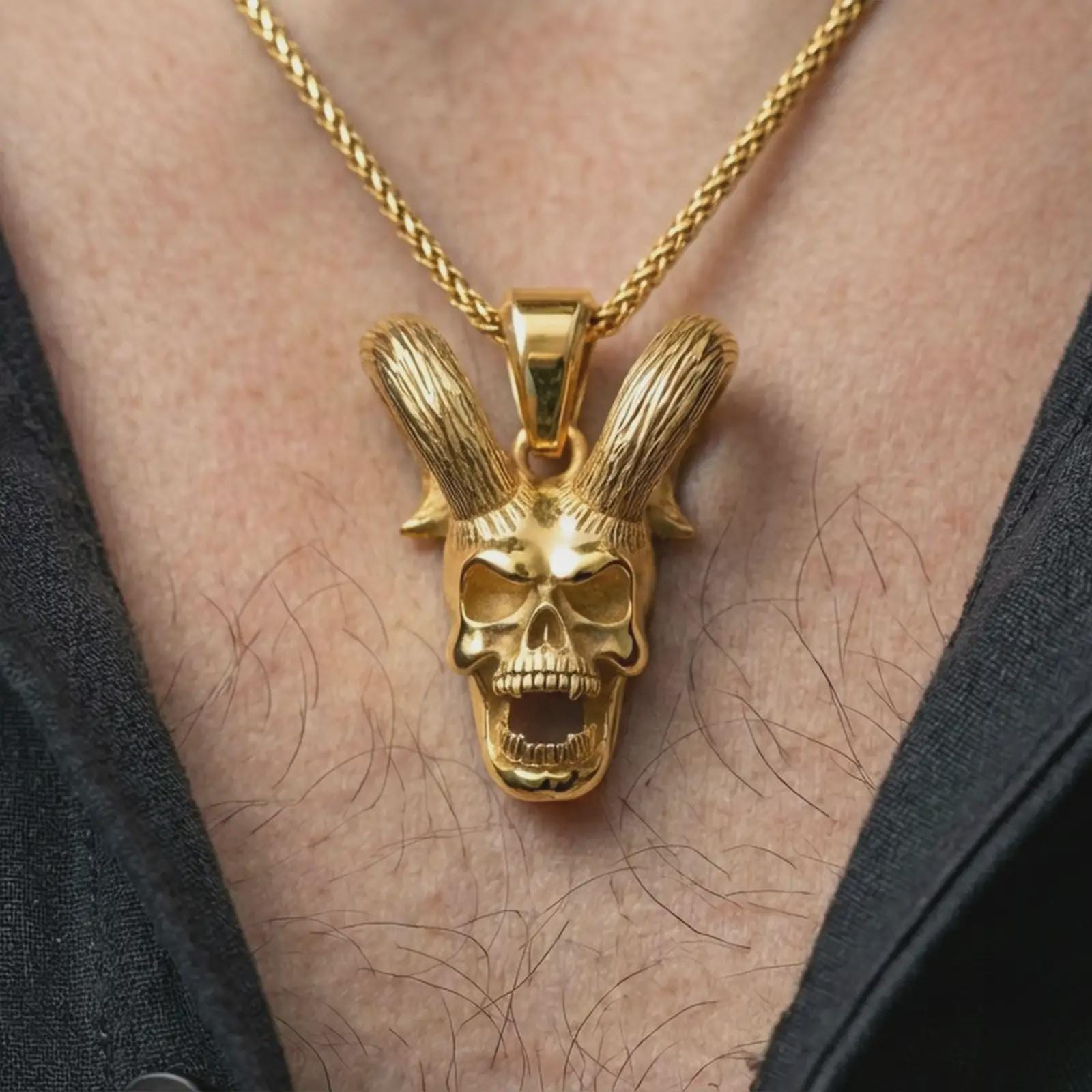 Gold plated rabbit skull pendant necklace worn on the neck, captured on a human model in a premium dark-toned lifestyle frame.