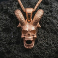 Load image into Gallery viewer, Rose gold plated rabbit skull pendant necklace on dark volcanic rock, photographed in a detailed premium studio macro view.
