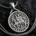 Load image into Gallery viewer, Sterling silver Knights Templar seal pendant necklace with an oxidized finish resting on textured volcanic rock, captured in a close-up premium studio composition.
