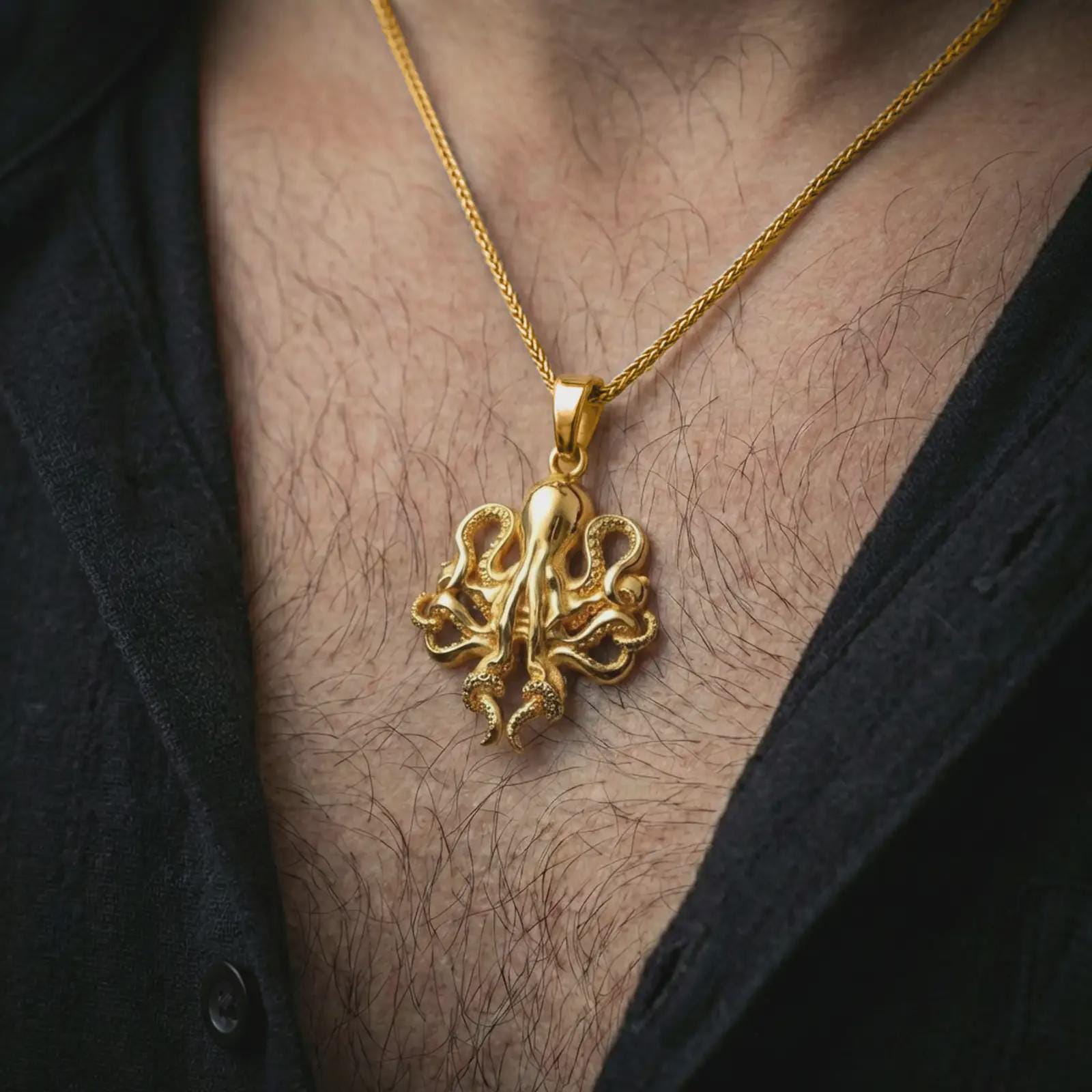 Gold plated octopus pendant necklace worn on the neck, captured on a human model in a premium dark-toned lifestyle frame.