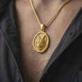 Load image into Gallery viewer, Gold plated fox medallion pendant necklace worn on the neck, captured on a human model in a premium dark-toned lifestyle frame.

