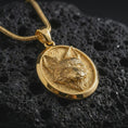 Load image into Gallery viewer, Gold plated fox medallion pendant necklace presented on porous volcanic rock, highlighting the elegant woodland fox motif in a luxurious close-up jewelry image.
