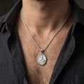 Load image into Gallery viewer, Polished silver Saint Nicholas pendant necklace worn on the neck, shown against the chest in a clean and elegant everyday wear composition.
