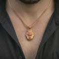 Load image into Gallery viewer, Rose gold plated crowned lion head pendant necklace worn on the neck, presented in a close-up lifestyle shot with a refined kingly aesthetic.

