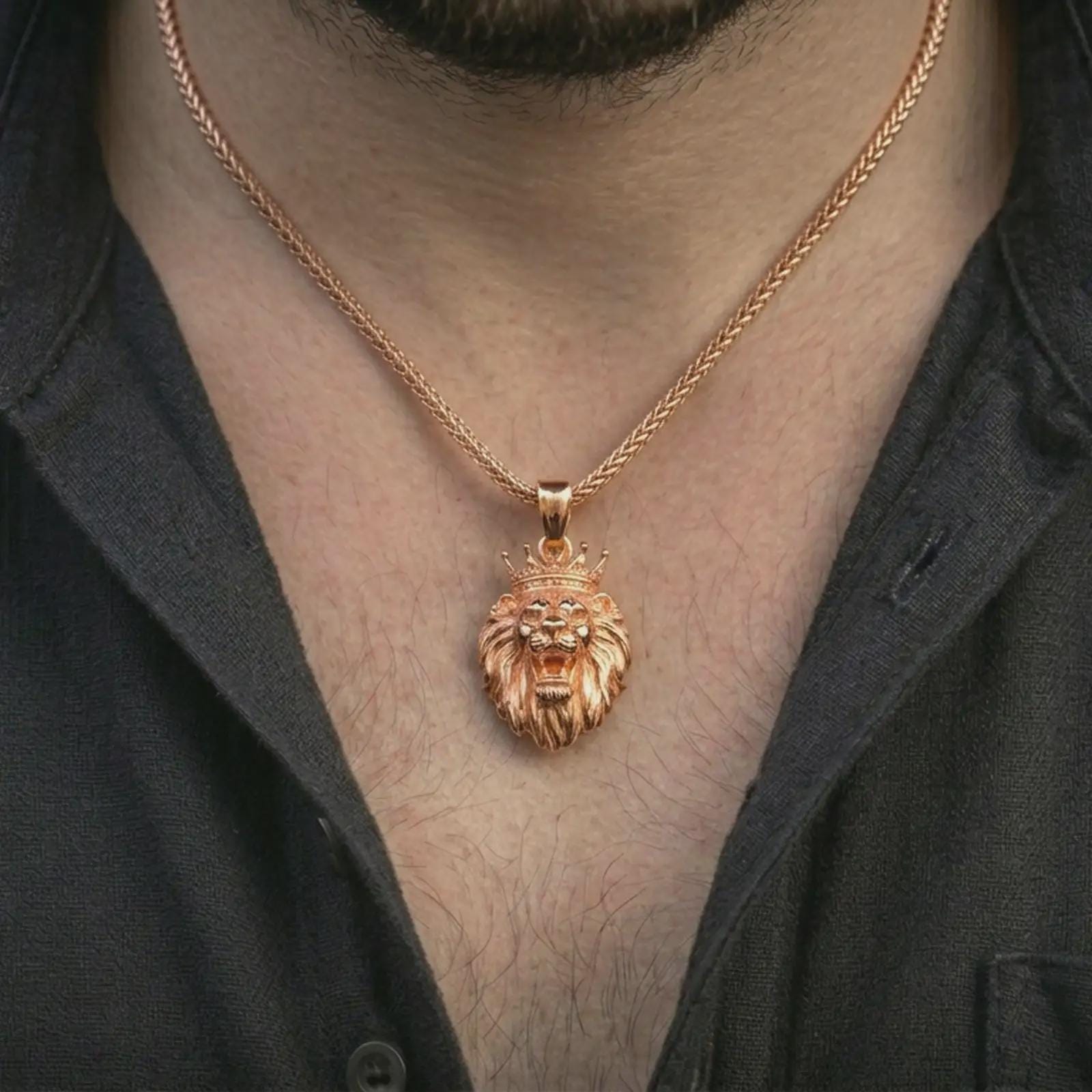 Rose gold plated crowned lion head pendant necklace worn on the neck, presented in a close-up lifestyle shot with a refined kingly aesthetic.