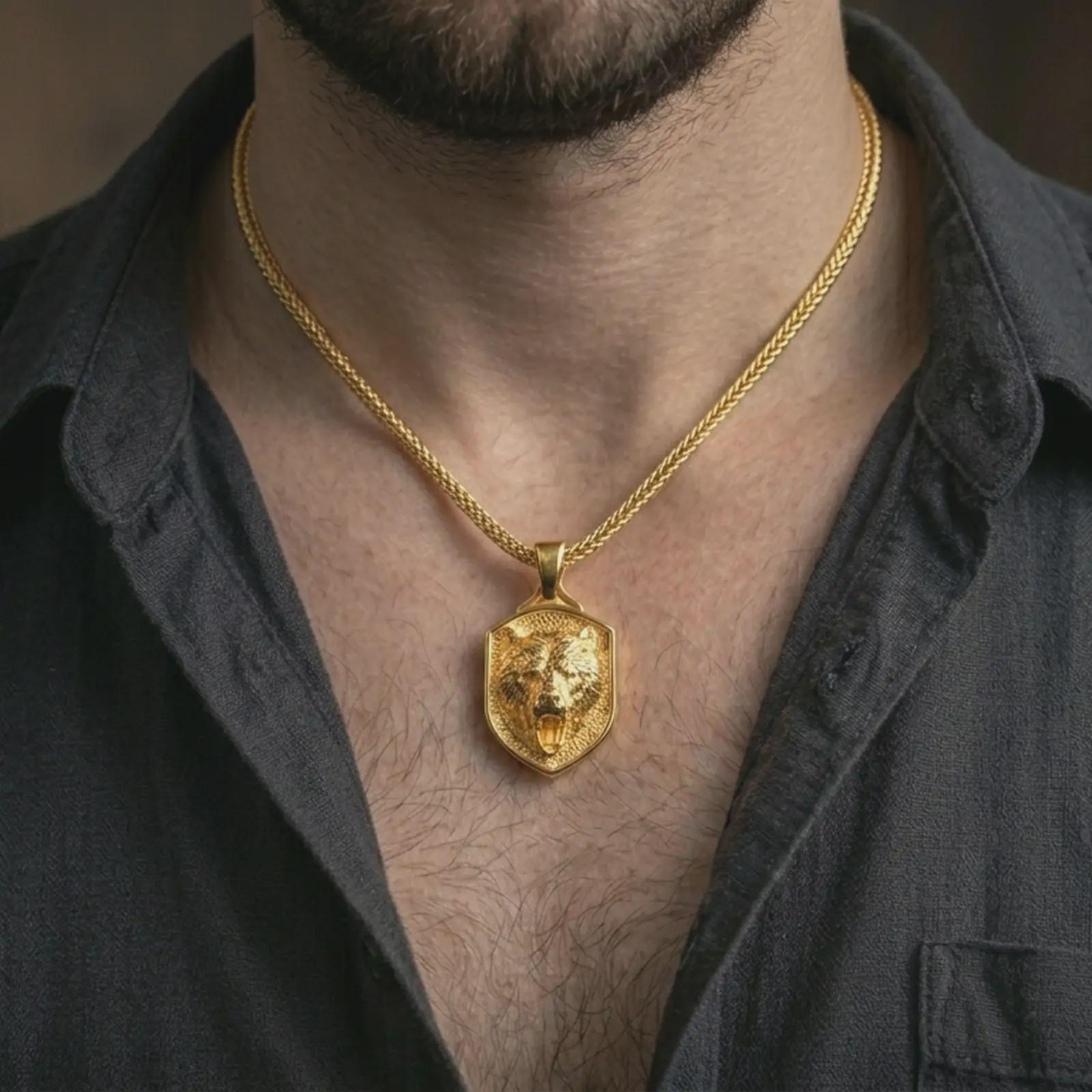 Gold plated roaring bear shield pendant necklace worn on the neck, captured on a human model in a premium dark-toned lifestyle frame.