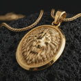 Load image into Gallery viewer, Gold plated lion medallion pendant necklace presented on porous volcanic rock, highlighting the noble animal motif in a luxurious close-up jewelry image.
