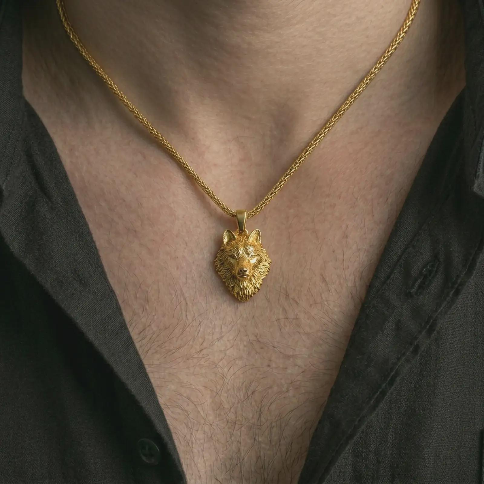 Gold plated wolf head pendant necklace worn on the neck, captured on a human model in a premium dark-toned lifestyle frame.