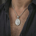 Load image into Gallery viewer, Polished silver Saint Hubert pendant necklace worn on the neck, shown against the chest in a clean and elegant everyday wear composition.
