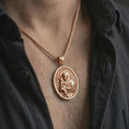 Load image into Gallery viewer, Rose gold plated Saint Anthony pendant necklace worn on the neck, presented in a close-up lifestyle shot with a refined masculine aesthetic.
