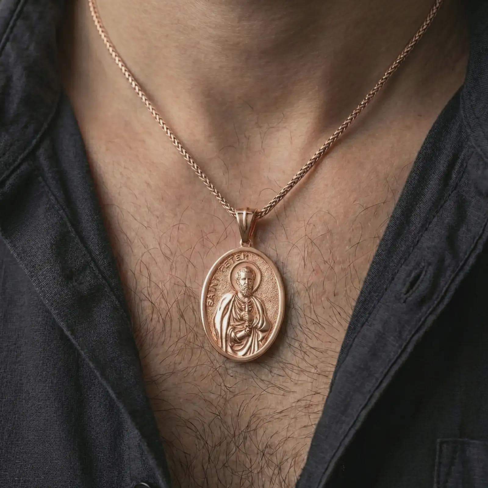 Rose gold plated Saint Peter pendant necklace worn on the neck, presented in a close-up lifestyle shot with a refined masculine aesthetic.