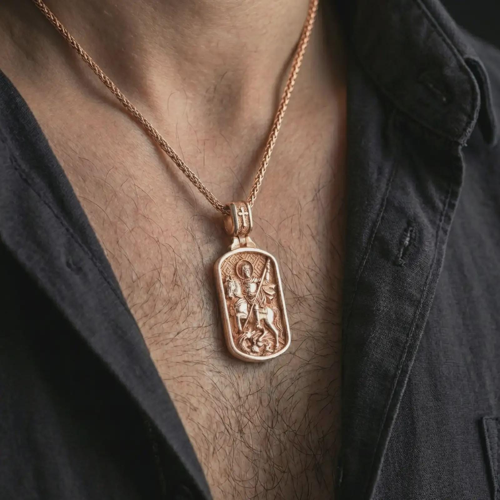 Rose gold plated Saint George dog tag pendant necklace worn on the neck, presented in a close-up lifestyle shot with a refined masculine aesthetic.