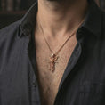 Load image into Gallery viewer, Rose gold plated Archangel Michael pendant necklace worn on the neck, presented in a close-up lifestyle shot with a refined masculine aesthetic.
