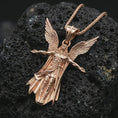 Load image into Gallery viewer, Rose gold plated Archangel Michael pendant necklace on dark volcanic rock, photographed in a detailed premium studio macro view.
