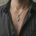 Load image into Gallery viewer, Polished silver Pegasus wing horse pendant necklace worn on the neck, shown against the chest in a clean and elegant everyday wear composition.
