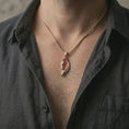 Load image into Gallery viewer, Rose gold plated Pegasus wing horse pendant necklace worn on the neck, presented in a close-up lifestyle shot with a refined mythology-inspired aesthetic.
