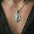 Load image into Gallery viewer, Polished silver gorilla shield pendant necklace worn on the neck, shown against the chest in a clean and striking everyday wear composition.
