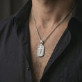 Load image into Gallery viewer, Polished silver Jesus INRI crucifixion pendant necklace worn on the neck, shown against the chest in a clean and elegant everyday wear composition.
