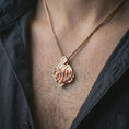 Load image into Gallery viewer, Rose gold plated chessboard pendant necklace worn on the neck, presented in a close-up lifestyle shot with a refined strategy-inspired aesthetic.
