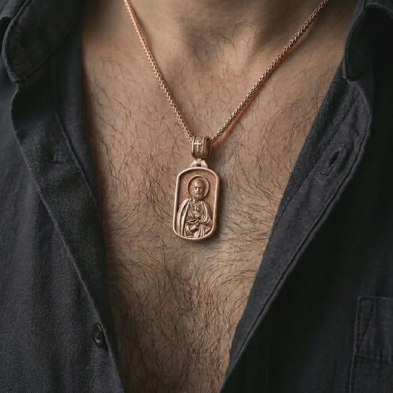 Rose gold plated Saint Peter dog tag pendant necklace worn on the neck, presented in a close-up lifestyle shot with a refined masculine aesthetic.