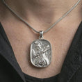 Load image into Gallery viewer, Polished silver Spartan warrior pendant necklace worn on the neck, shown against the chest in a clean and elegant everyday wear composition.
