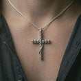 Load image into Gallery viewer, Polished silver skull cross pendant necklace worn on the neck, shown against the chest in a clean and edgy everyday wear composition.
